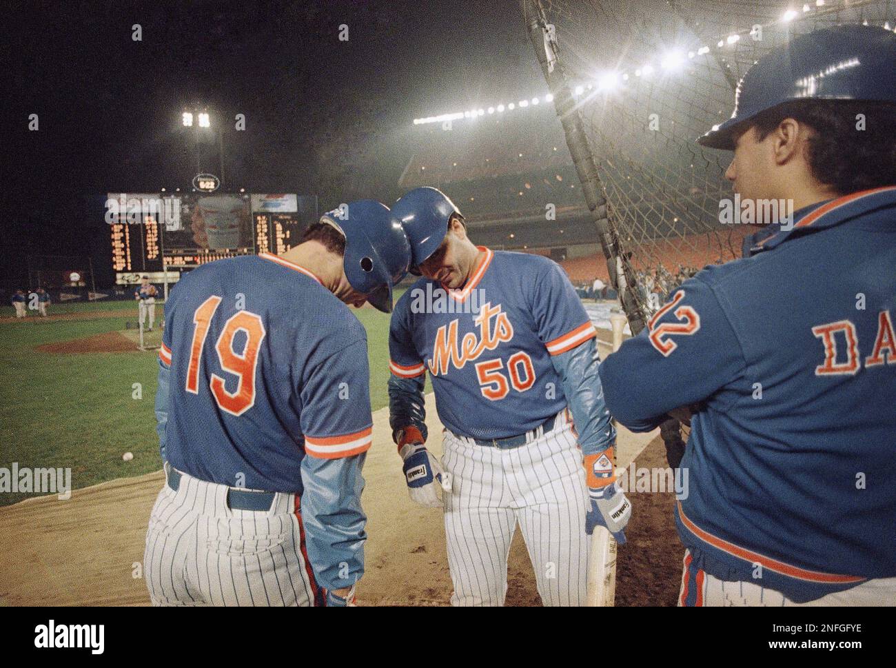 New York Mets pitchers Bob Ojeda, left, and Sid Fernandez butt heads  together on the field at New York's Shea Stadium Monday, Oct. 27, 1986,  during their pre game ritual prior to