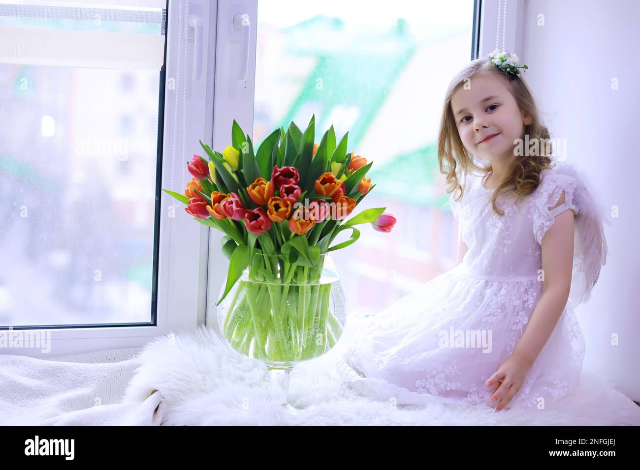 Beautiful girl in white dresses with a magnificent bouquet of first ...