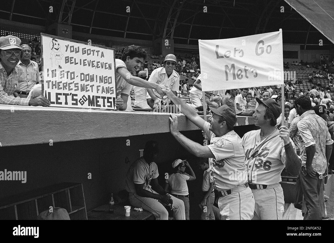 New YorK Mets coach Tom Burgess, left and pitcher Jerry Koosman meet