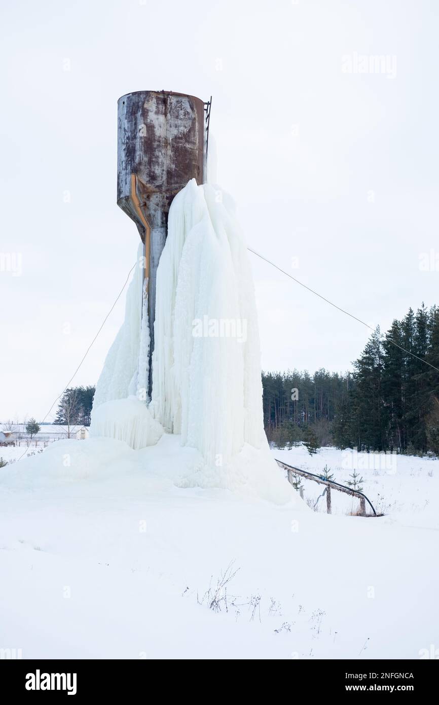 frozen water tower. The water turned to ice. Abnormal cold Stock Photo