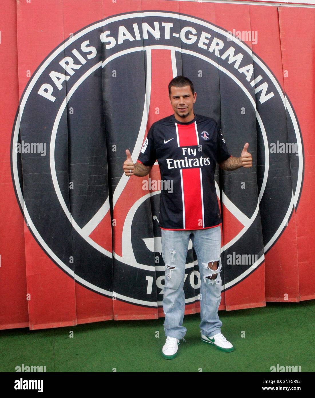 New Paris Saint Germain signing Mateja Kezman poses with his new