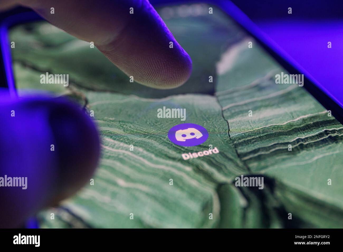 Discord chat app on smartphone screen. Close up shot of Discord chat