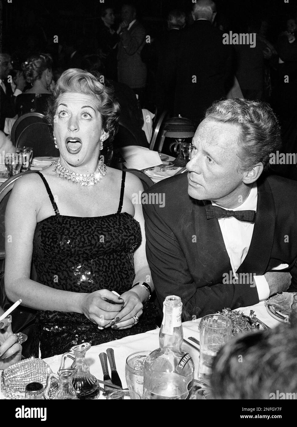 Actor Van Johnson, right, shown with wife, Eve Lynn Abbott, at a night