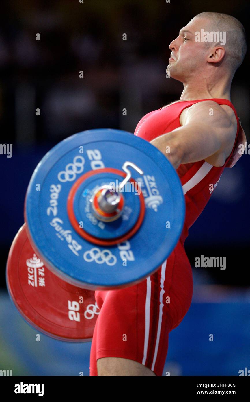 Szymon Kolecki, of Poland, lifts 174 kilograms in the snatch of the mens 94 kg of the weightlifting competition at the Beijing 2008 Olympics in Beijing, Sunday, Aug