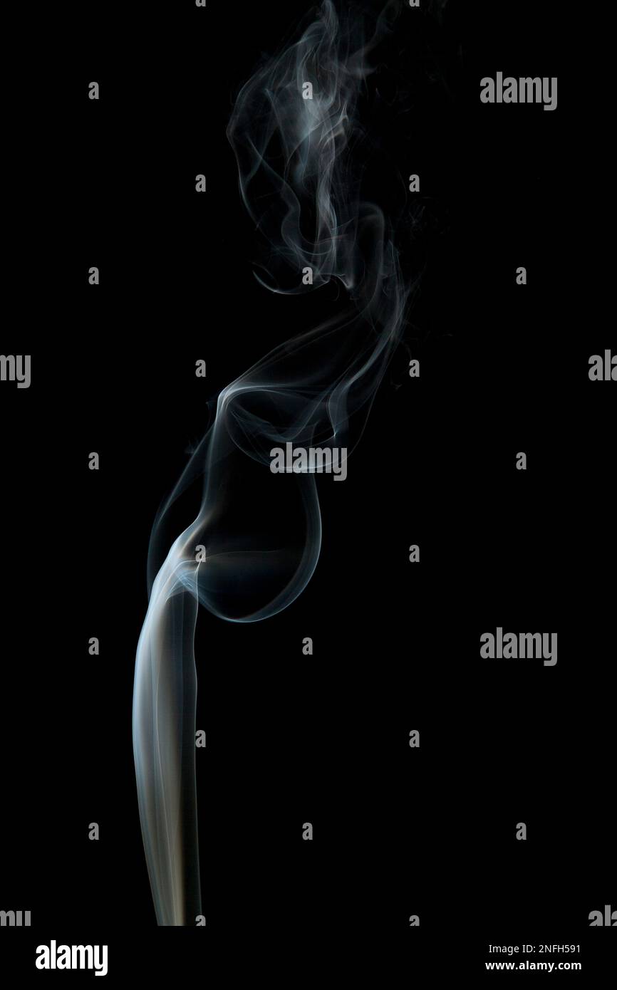 Abstract ghostly smoke in woman shape on a black background. Stock Photo