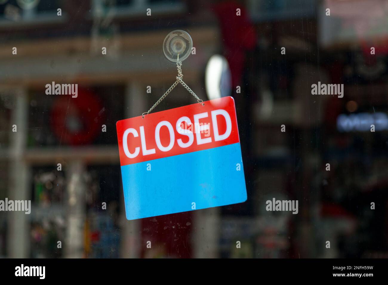 Circular blue sign in the window of a shop saying in French Magasin ouvert  à tous, meaning in english Store open to all Stock Photo - Alamy