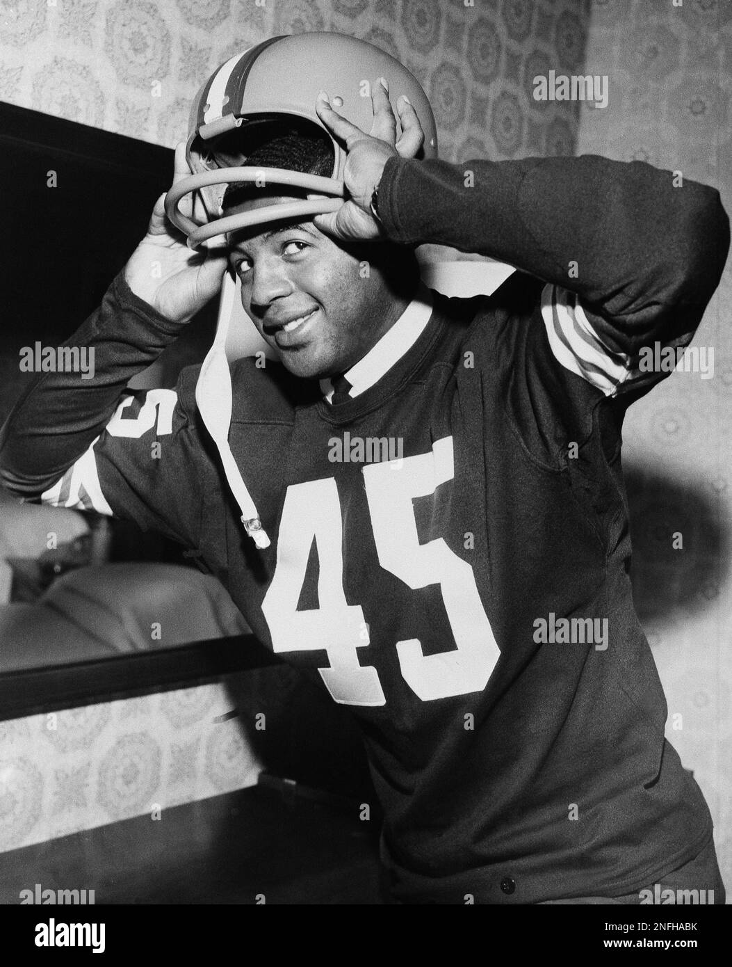 All-America halfback Ernie Davis of Syracuse, who has signed a 3-year,  $80,000 contract with the Cleveland Browns of the National Football League,  is making his first visit this weekend. He may or