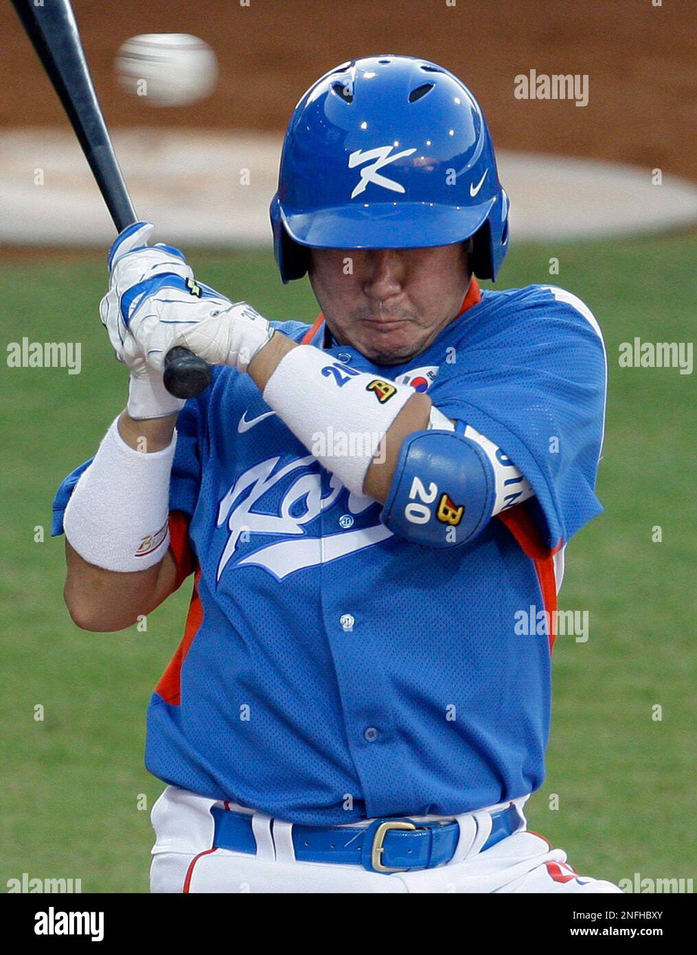 South Korea's Kab Yong Jin (#20) and Seung Youp Lee (#25) celebrate with  after their 7-3 win over the United States at the World Baseball Classic in  Anaheim, California on March 13