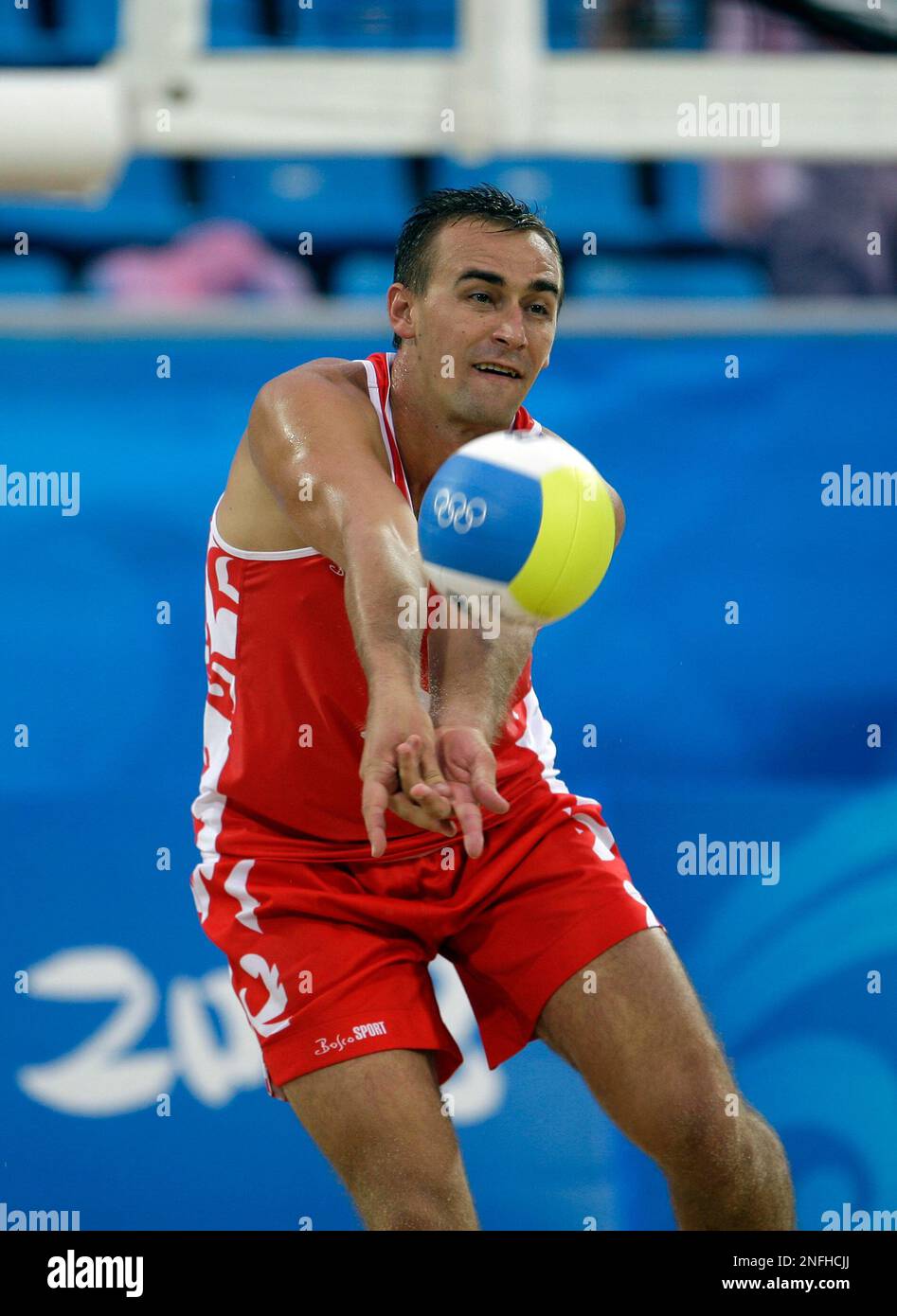 Russia's Dimitri Barsouk against Brazil in a beach volleyball match at ...