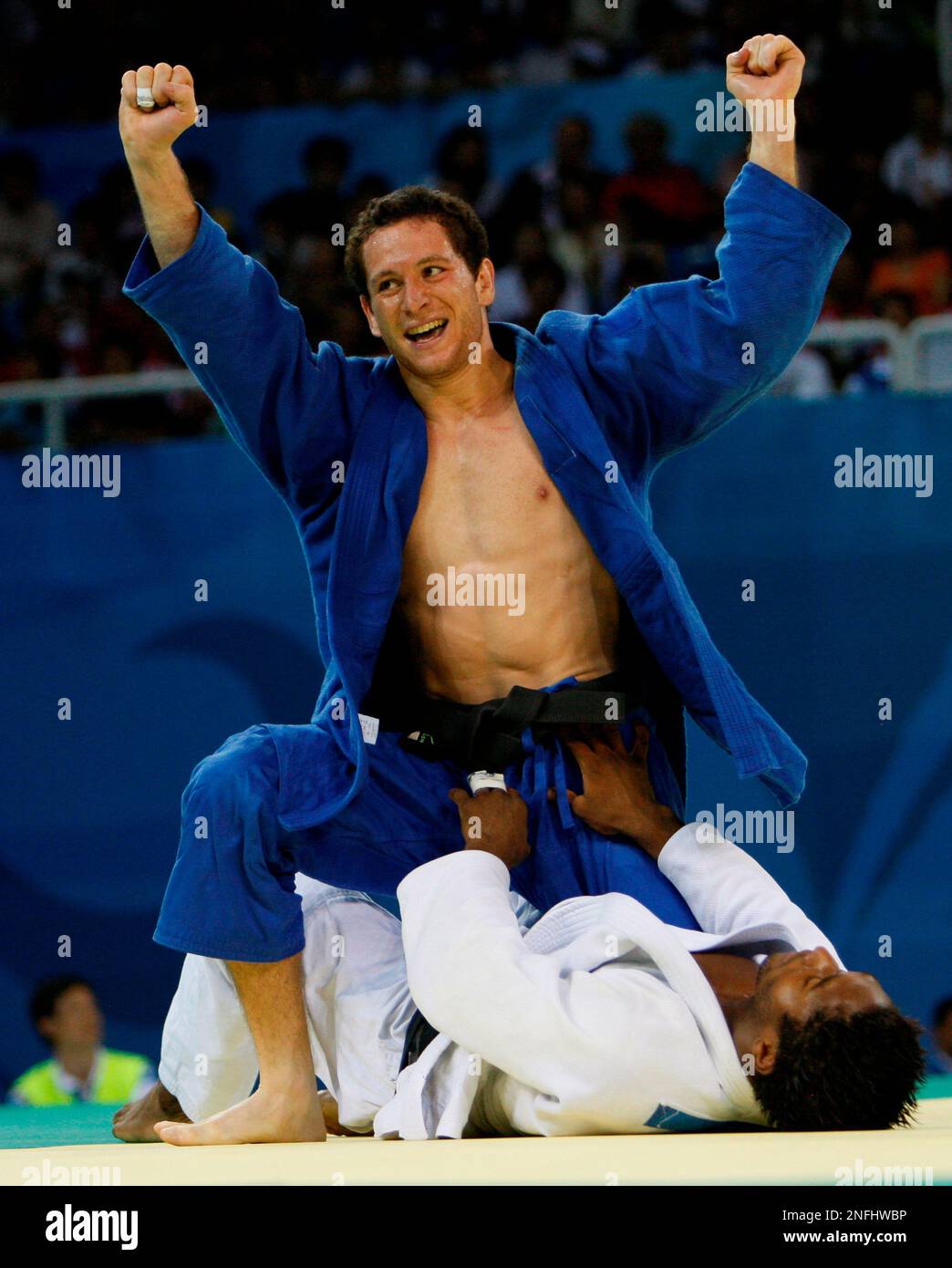 Tiago Camilo of Brazil celebrates his bronze win over the Netherlands Guillaume Elmont at the judo half middleweight division finals at the Beijing 2008 Olympics in Beijing, Tuesday, Aug. 12, 2008. (AP Photo/Charles Dharapak) Stock Photo