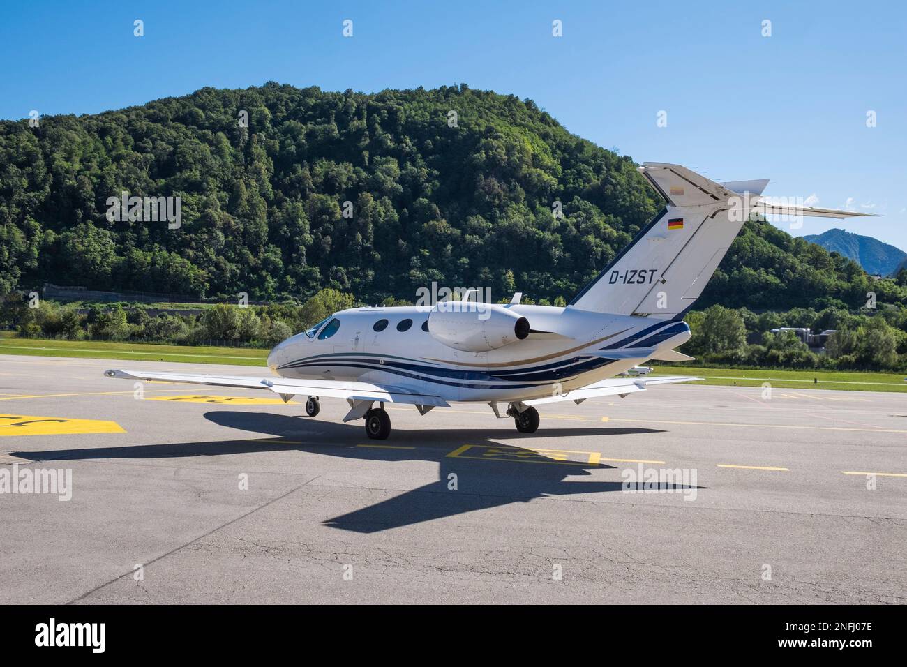 Switzerland, AgnoLugano Airport, Plane stationed on the runway Stock