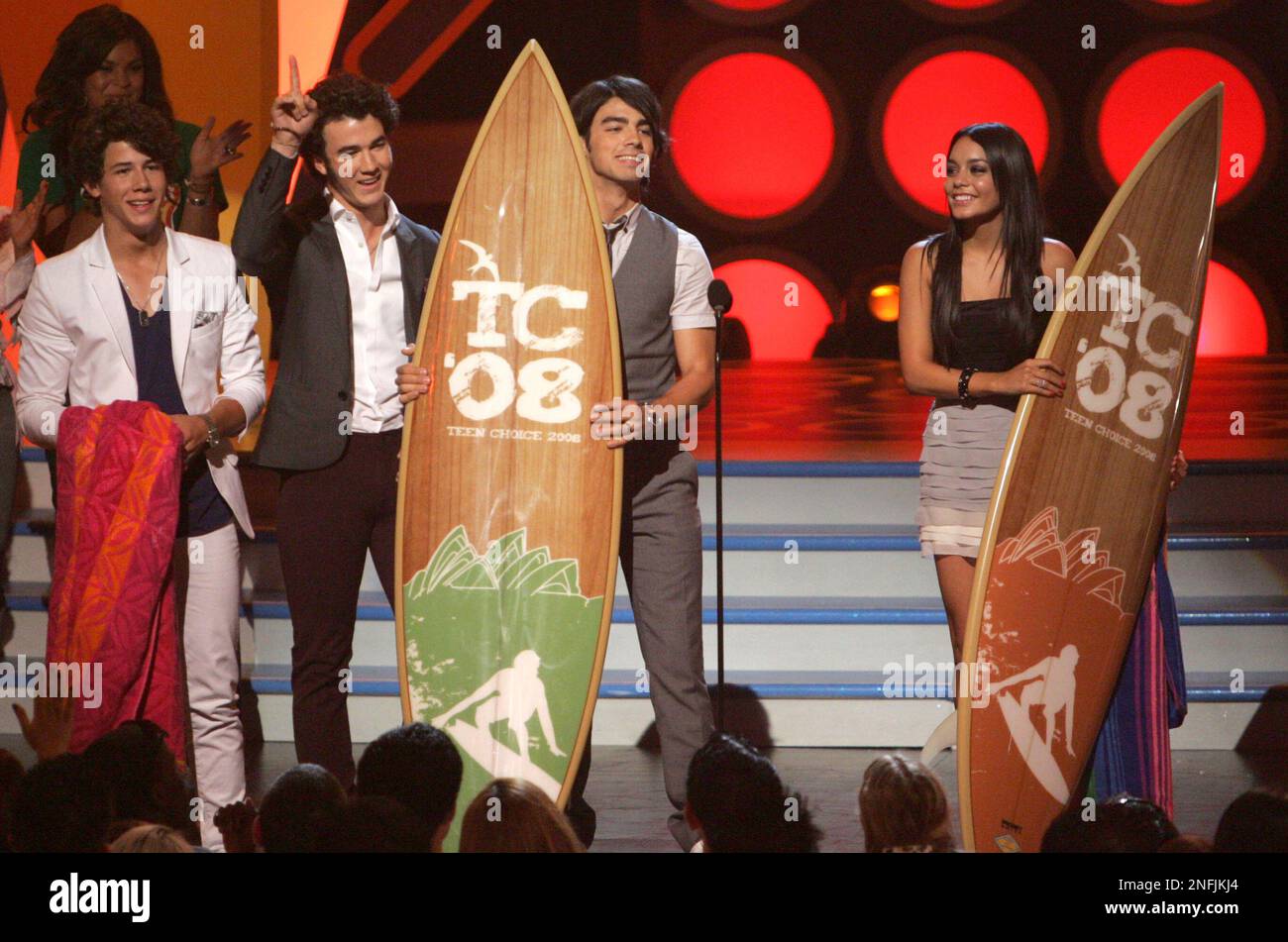 The Jonas Brothers and Vanessa Hudgens on stage at the Teen Choice