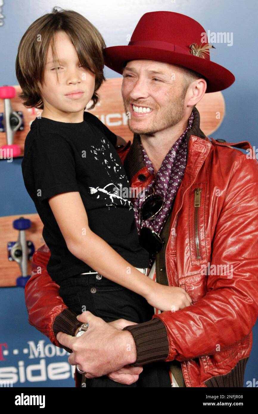 Singer Scott Weiland, right, and his son Noah Weiland pose on the press