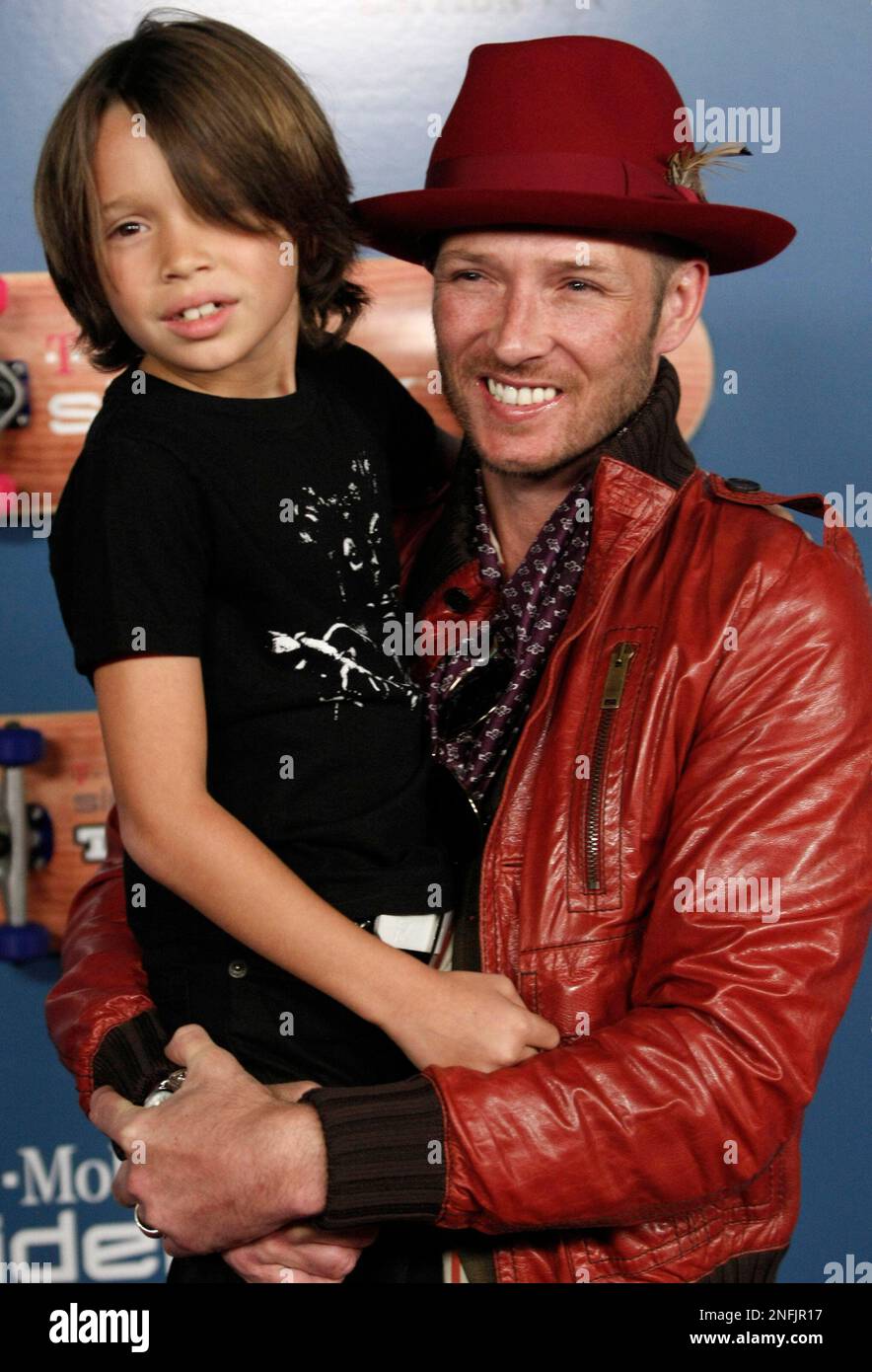 Singer Scott Weiland, right, and his son Noah Weiland pose on the press