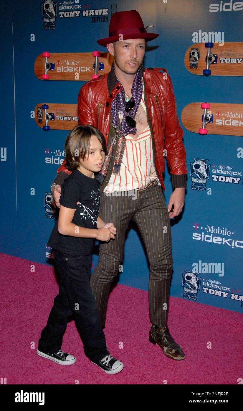 Singer Scott Weiland, right, and his son Noah Weiland pose on the press
