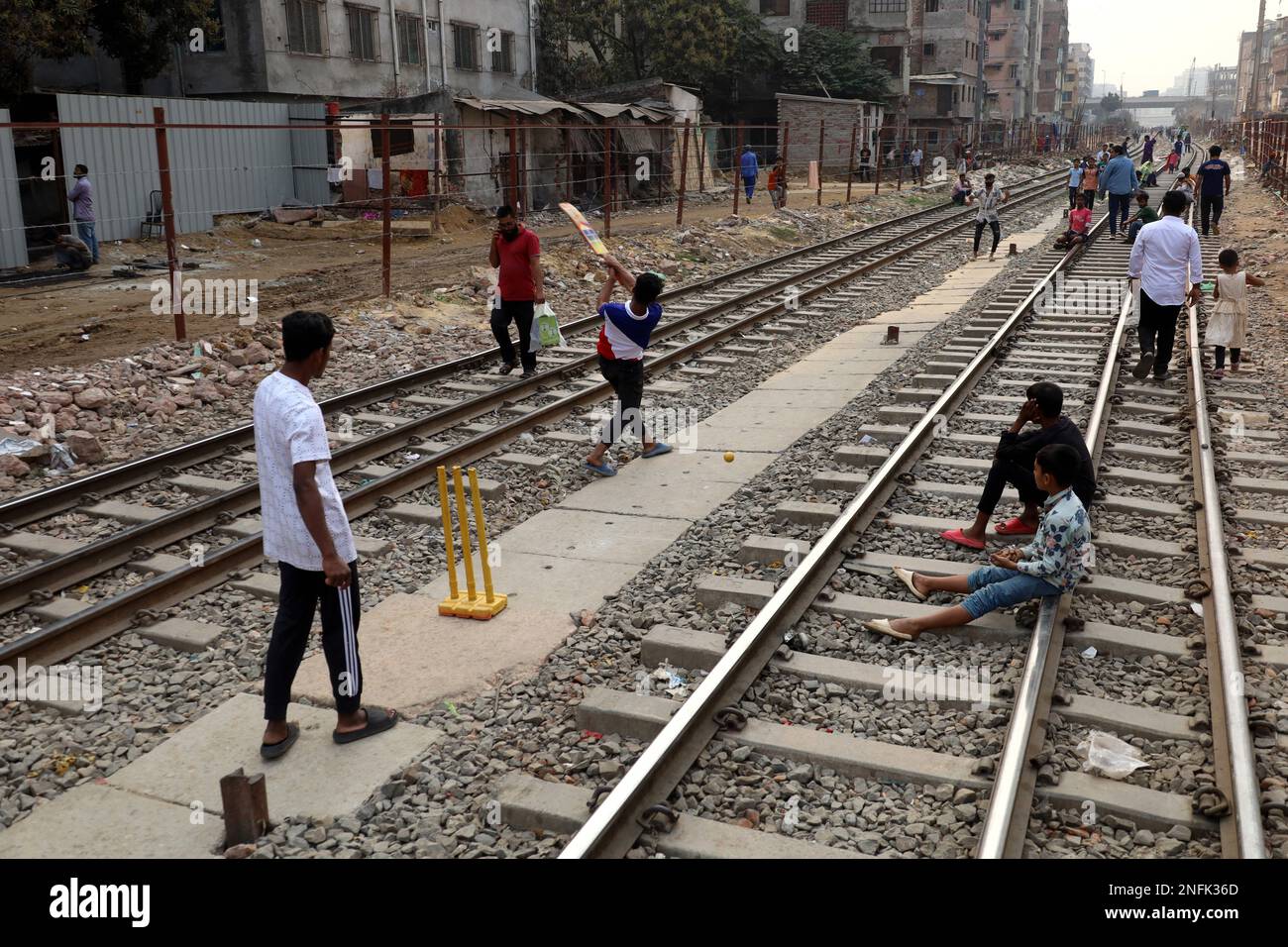 Dhaka, Dhaka, Bangladesh. 17th Feb, 2023. Due to lack of adequate playground in Dhaka, boys are playing cricket between two railway lines. (Credit Image: © Syed Mahabubul Kader/ZUMA Press Wire) EDITORIAL USAGE ONLY! Not for Commercial USAGE! Stock Photo