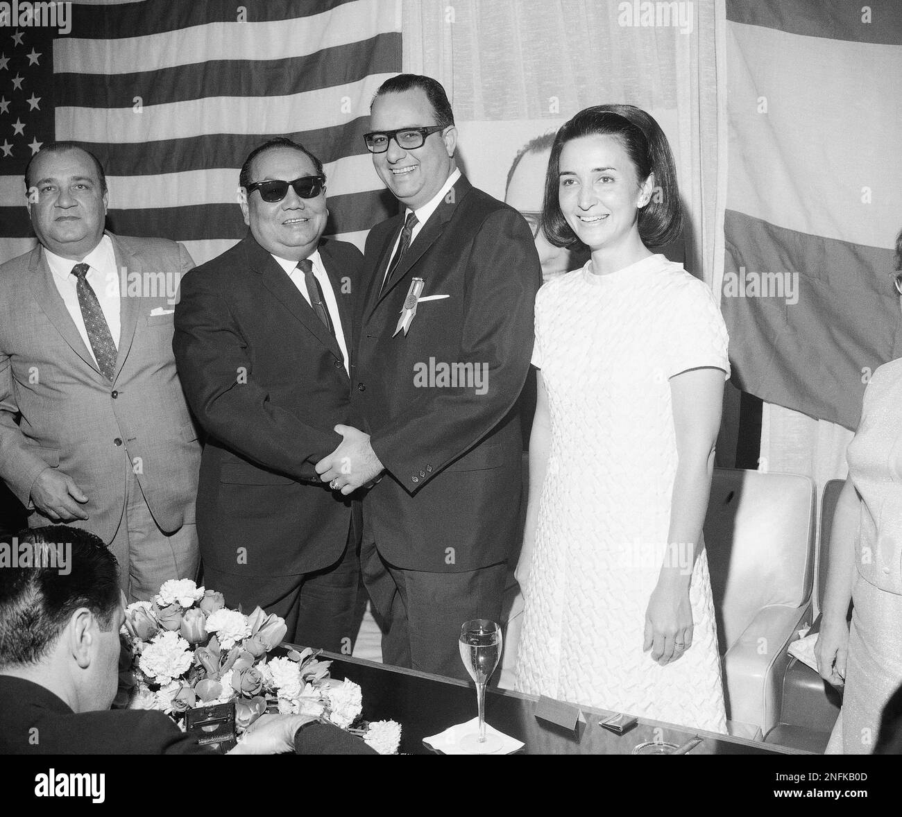 Gen. Anastasio Somoza Debayle Jr., at center, and his wife Hope Portocarrero  of Nicaragua are shown at the Overseas Press Club luncheon, March 19, 1967.  Others are unidentified. (AP Photo Stock Photo - Alamy