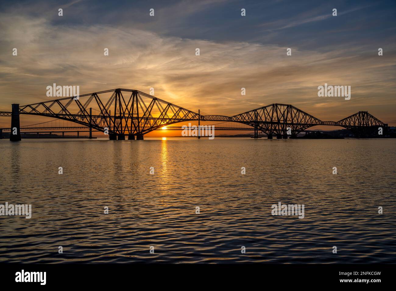 The Forth Rail Bridge at sunset, with the Forth Road Bridge and
