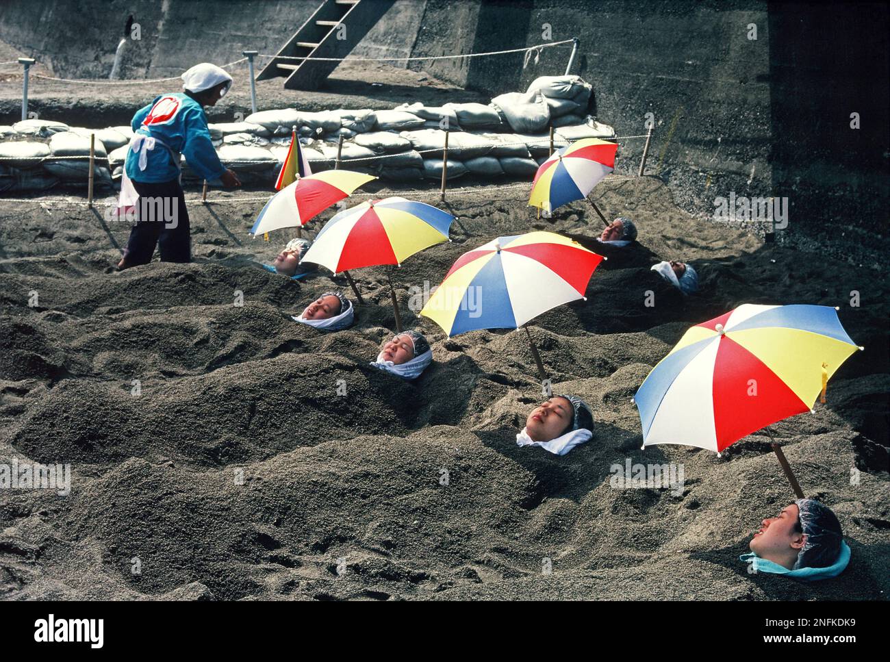 Japan. Kyushu. Kagoshima. Ibusuki beach. People in hot volcanic sand baths. Stock Photo