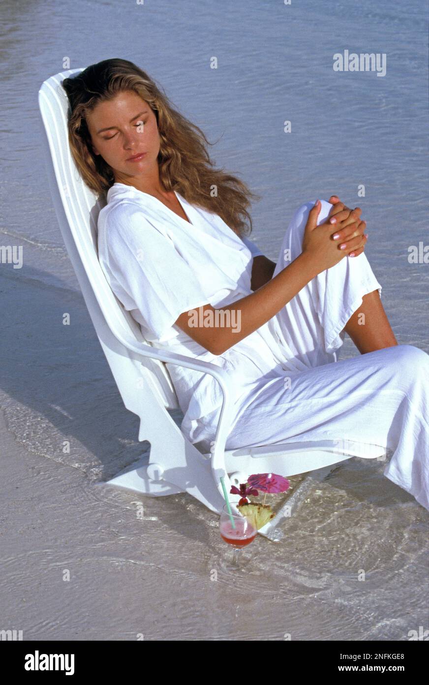 Woman sitting chair full length hi-res stock photography and images - Alamy