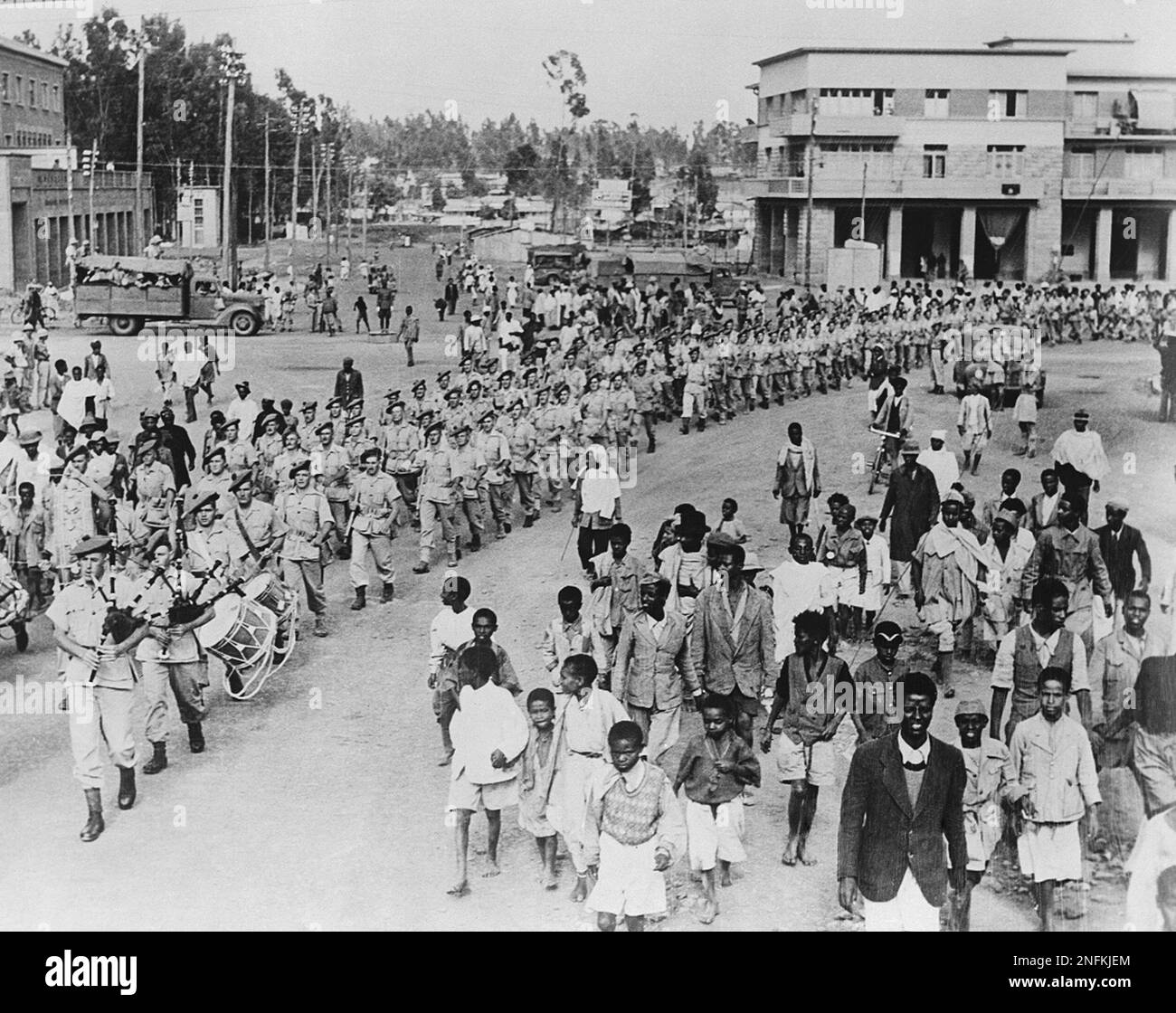 In this British Official Photo, native Ethiopian children follow ...