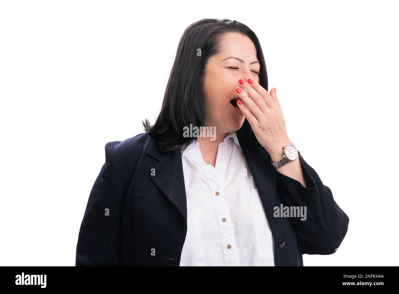 Tired hardworking businesswoman wearing smart casual suit covering mouth as yawning sleepy gesture corporate professional executive concept isolated o Stock Photo
