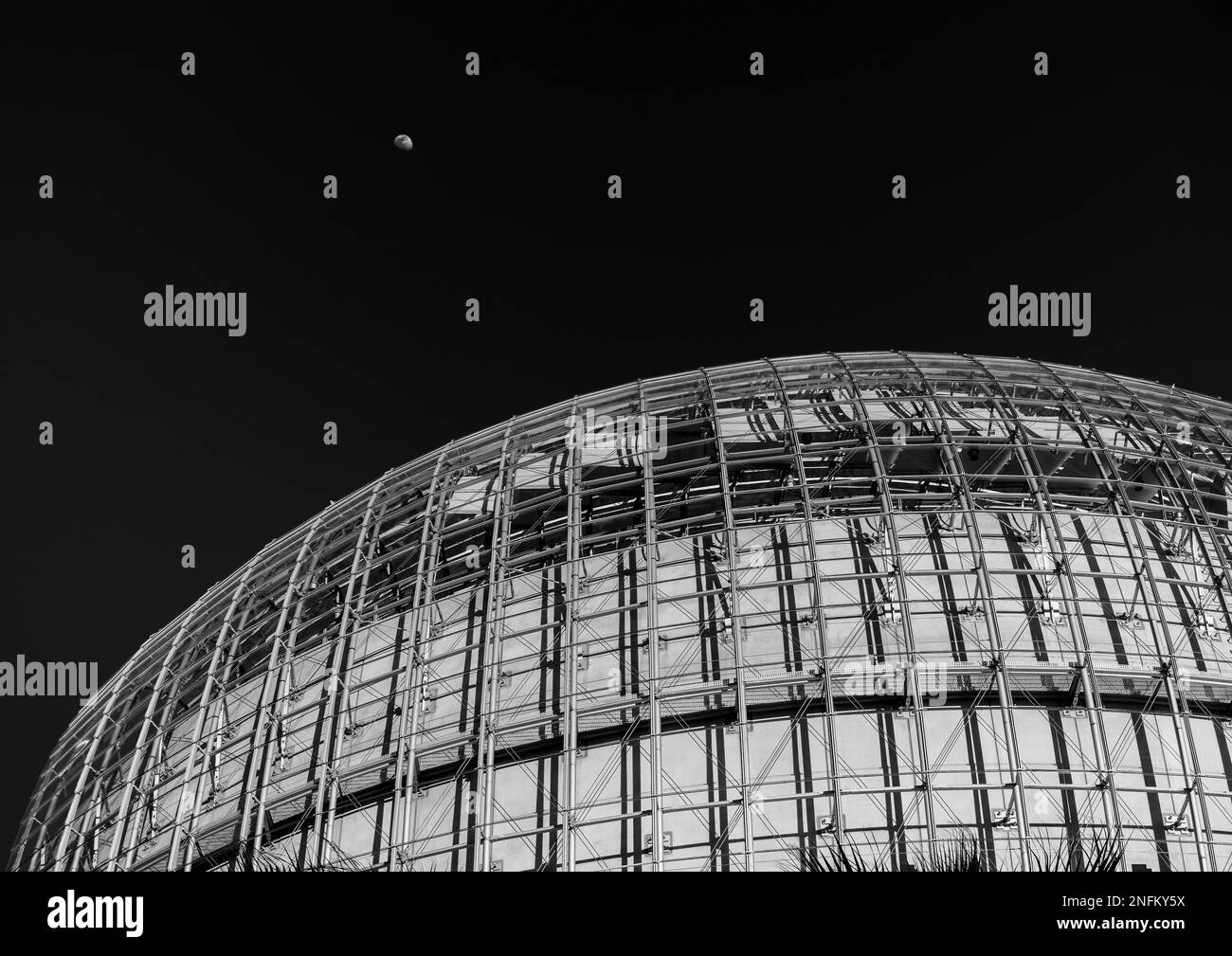 A grayscale of the Academy Museum of Motion Pictures at night in Los