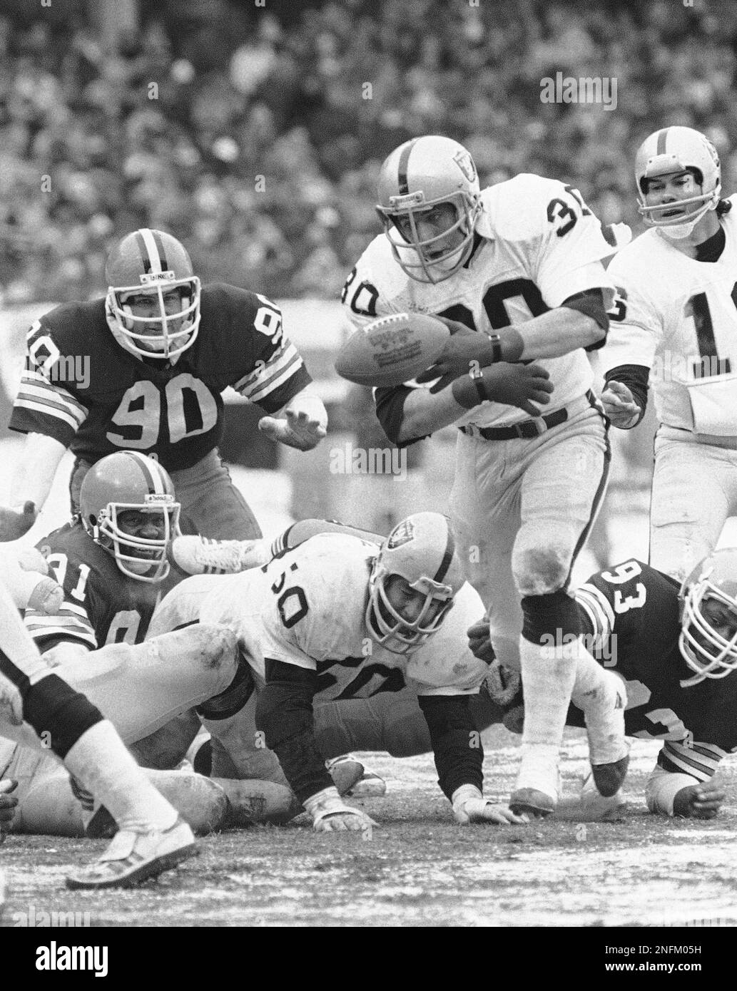 Oakland Raiders fullback Mark van Eeghen (30) loses control of the ball  momentarily on the one-yard line in the second quarter of AFC playoff game  Sunday, Jan. 4, 1981 in Cleveland. The