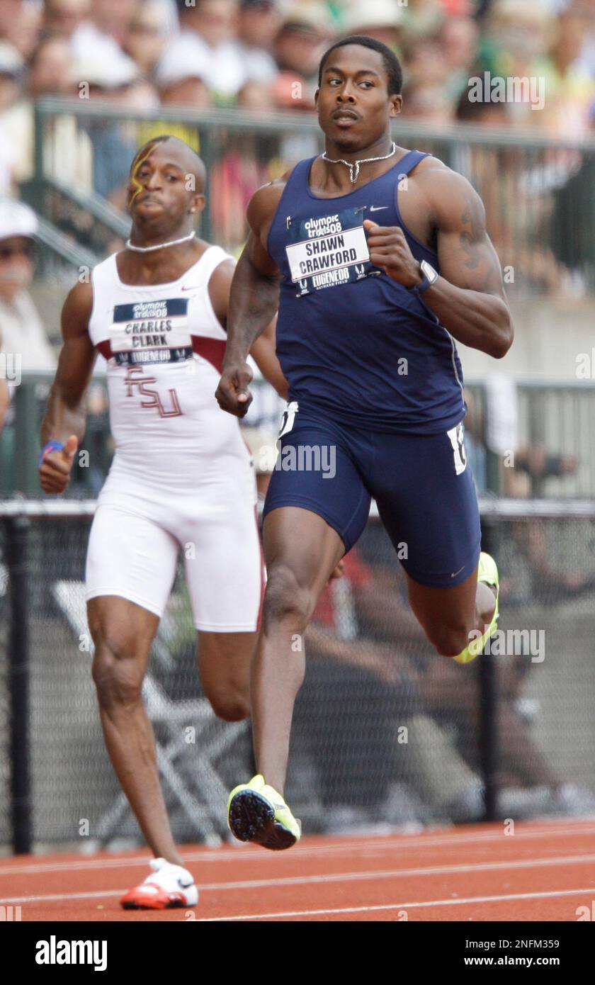 Shawn Crawford beats Charles Clark to the line in the fourth heat of ...