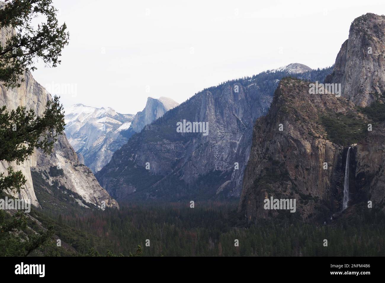 Panoramic view of El Capitan, Bridalveil Fall, and Half Dome at Yosemite National Park Stock Photo