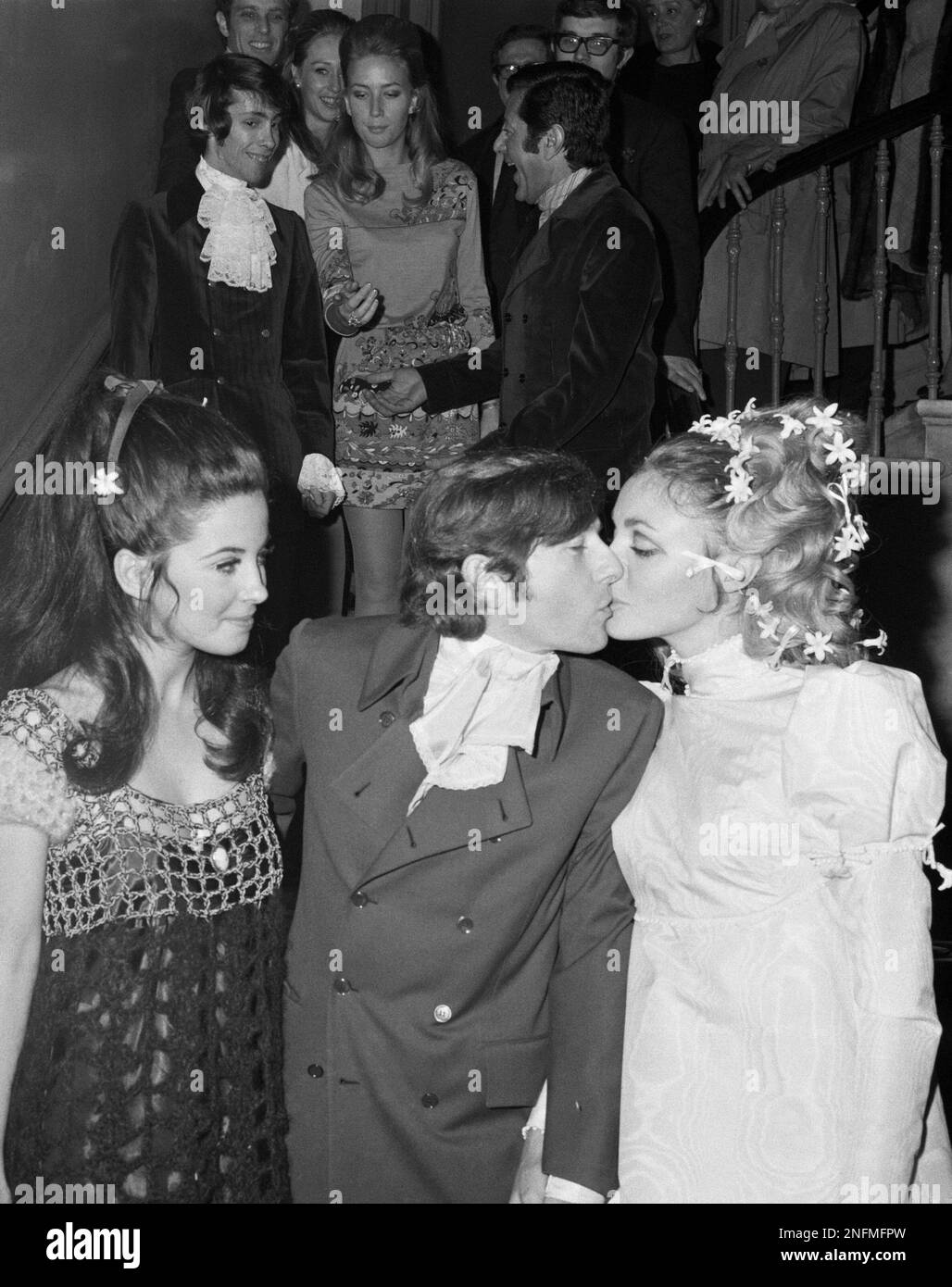 Polish-born film director Roman Polanski kisses his bride American actress  Sharon Tate after their marriage at Chelsea Registry Office, London, Jan.  20, 1968. American actress Barbara Parkins of television's 'Pevton Place',  looks