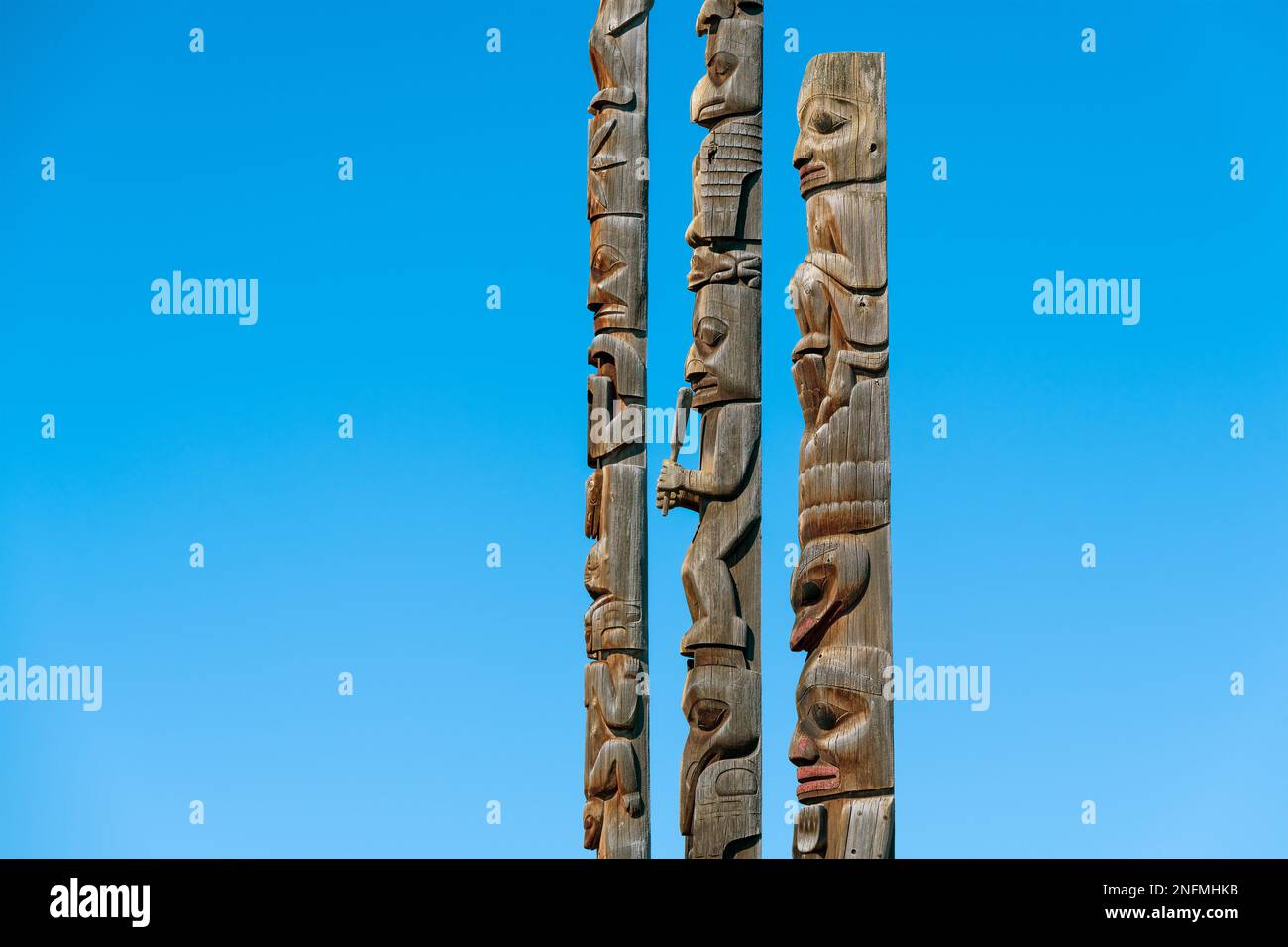 Totem poles of Gitanyow or Kitwancool in British Columbia, Canada. Stock Photo