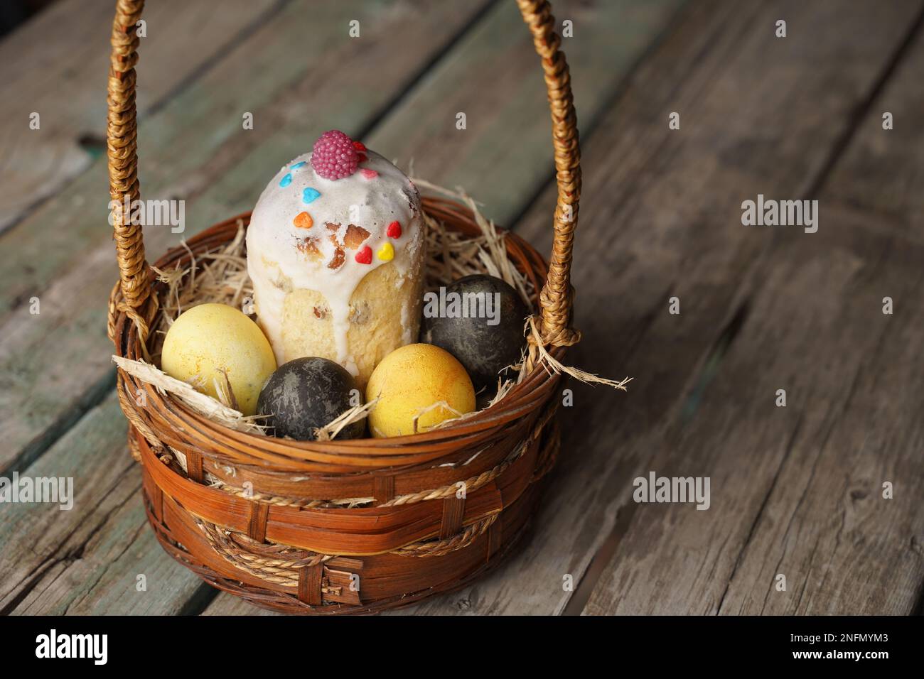 Easter traditional food with eggs and bread in basket. Holidays background. Easter basket filled
