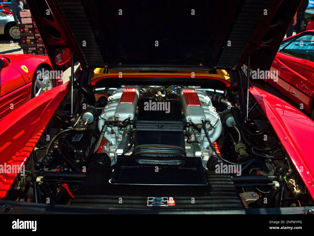 Red Ferrari Engine Hood Open Sparkling Clean Engine Stock Photo