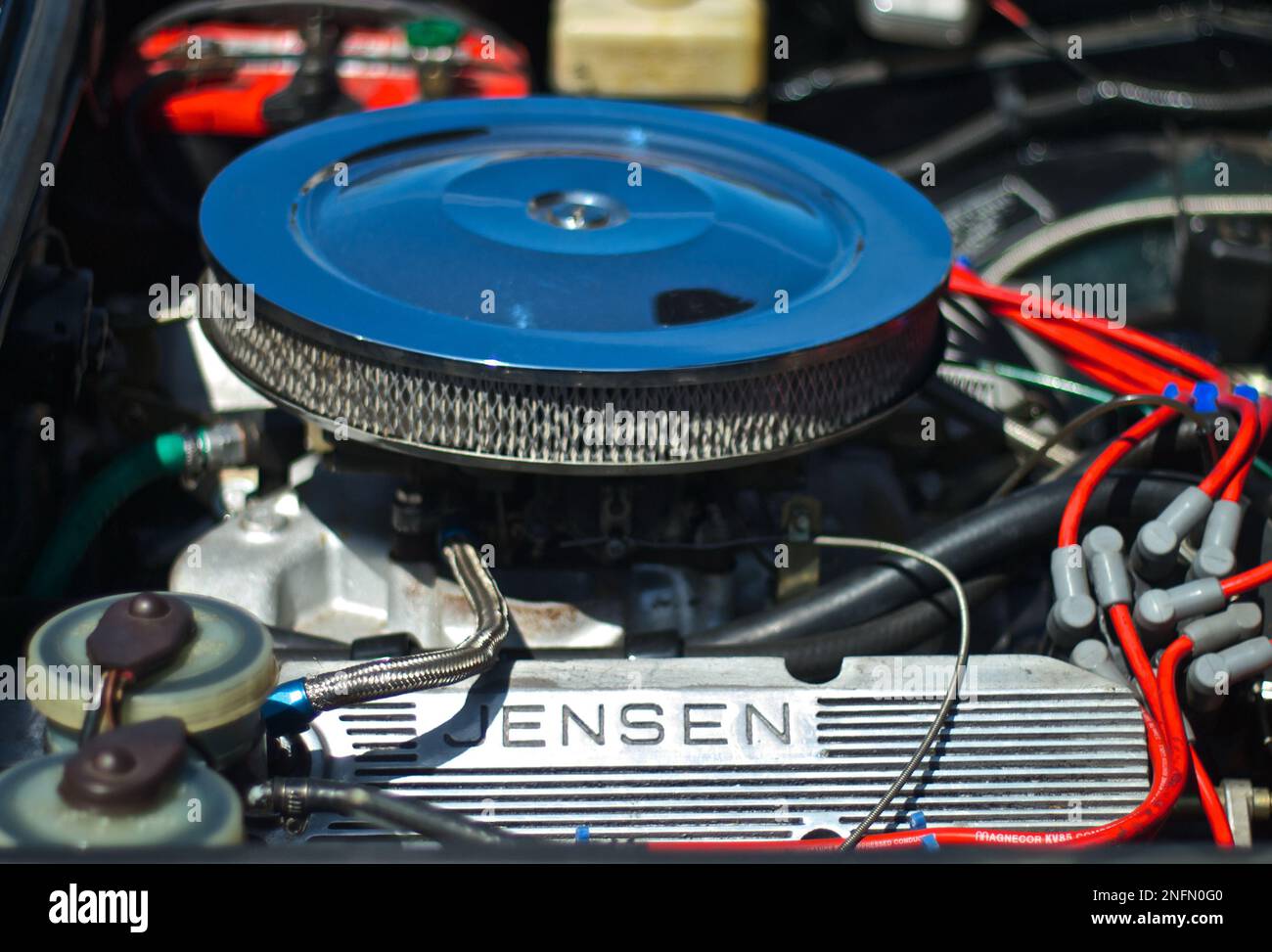 Classic British Sport Car Jensen Engine Part in Bokeh Depth of Field Background Stock Photo