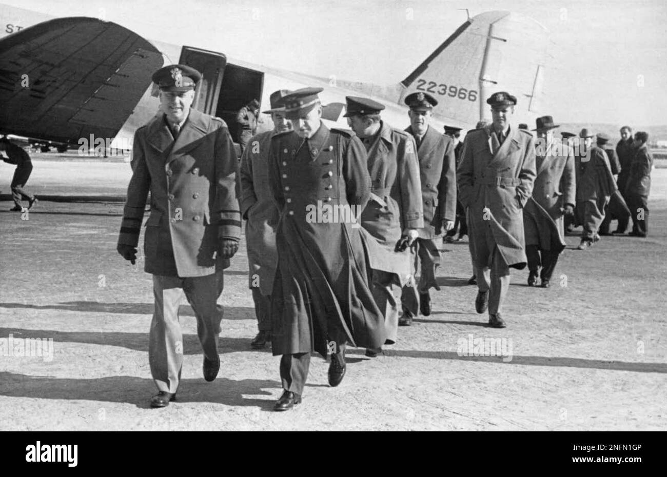Spanish Air Force officers greet Maj. Gen. William H. Tunner, left