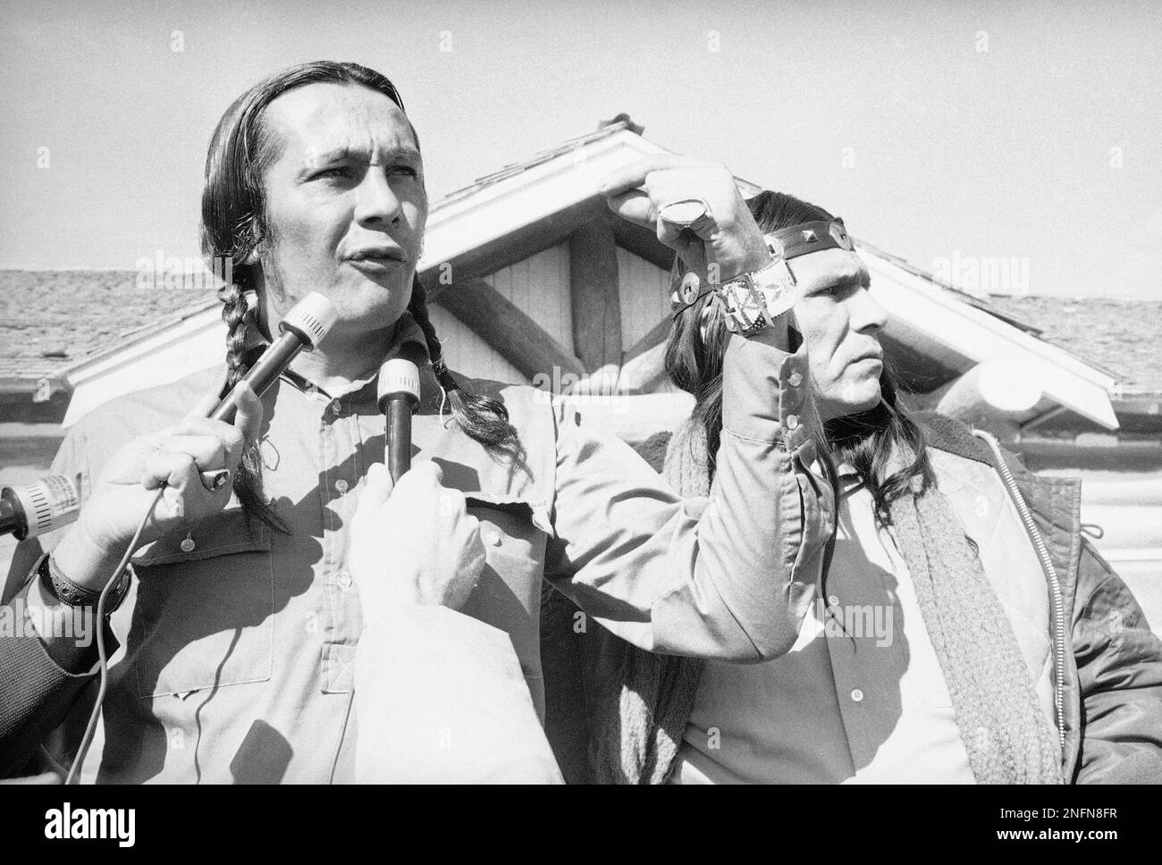 Russell Means, AIM leader on the Pine Ridge Reservation, left, tells