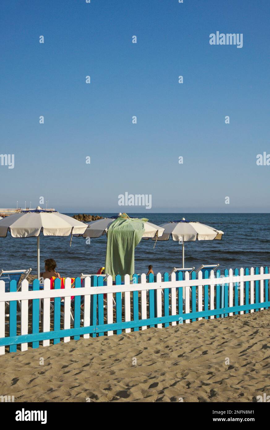 fence to separate a private beach in Marina di Massa, Versilia, Tuscany, Italy Stock Photo