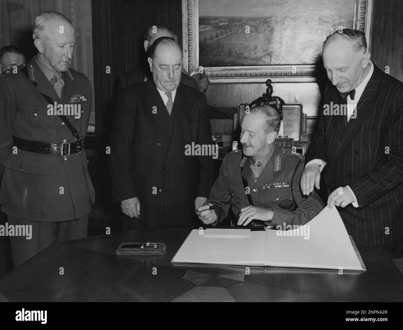 The new city commander Major General W.P. Oliver puts his signiature in ...