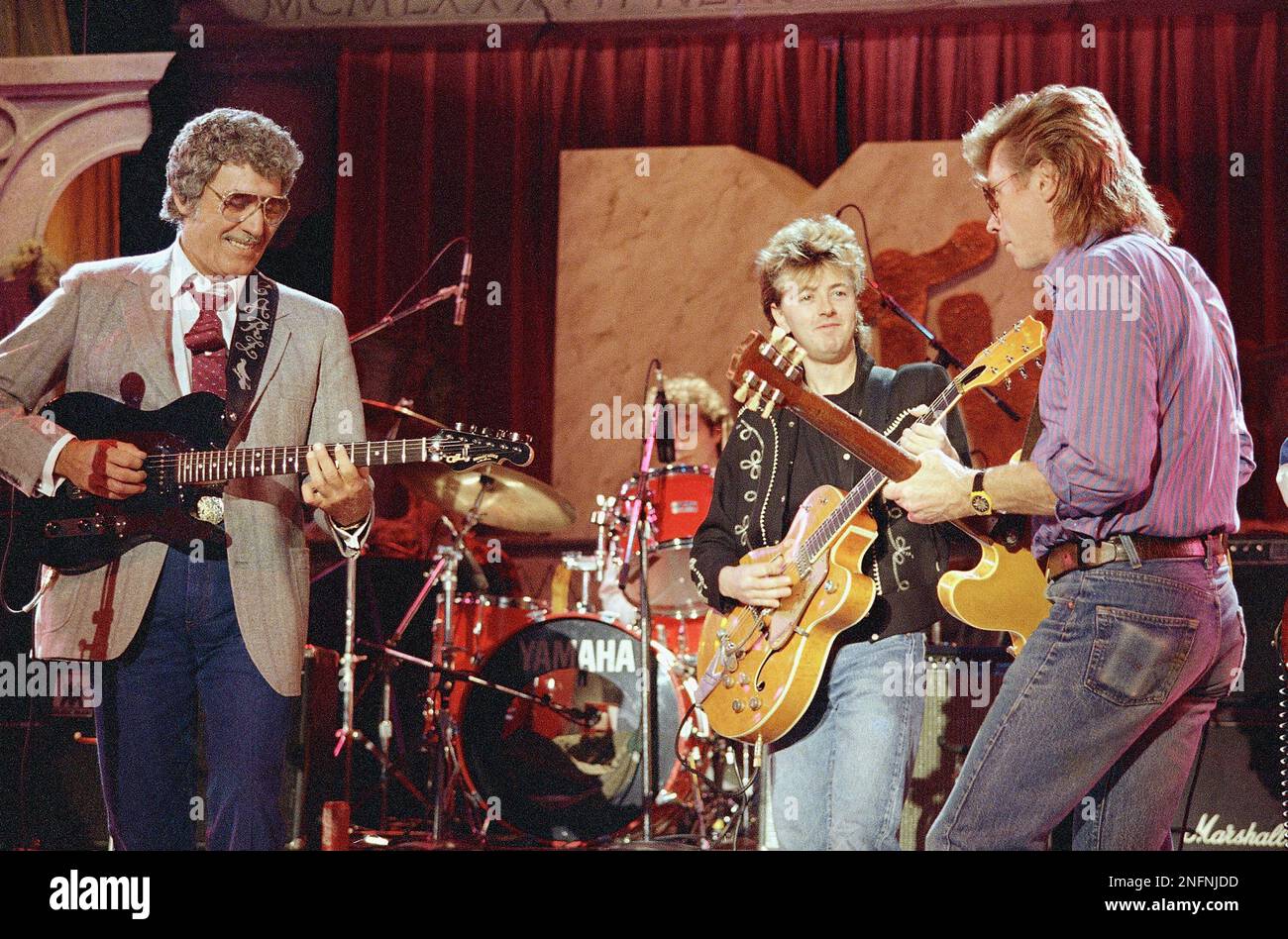 Rockabilly singer Carl Perkins, left, is shown rocking in the New Year ...