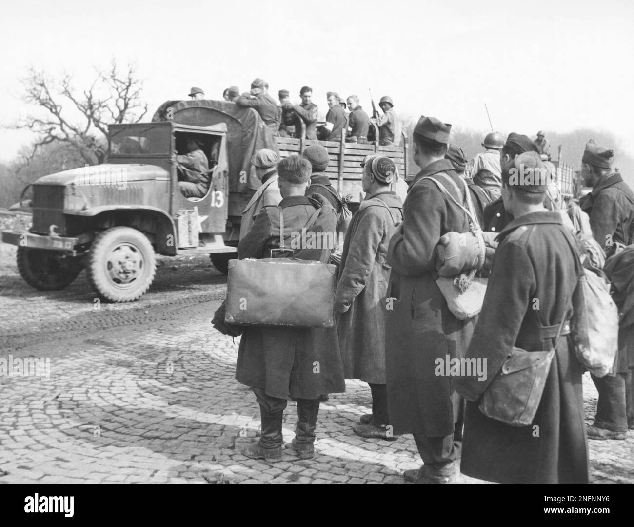 Russian prisoners of war who were freed by the Americans watch a ...