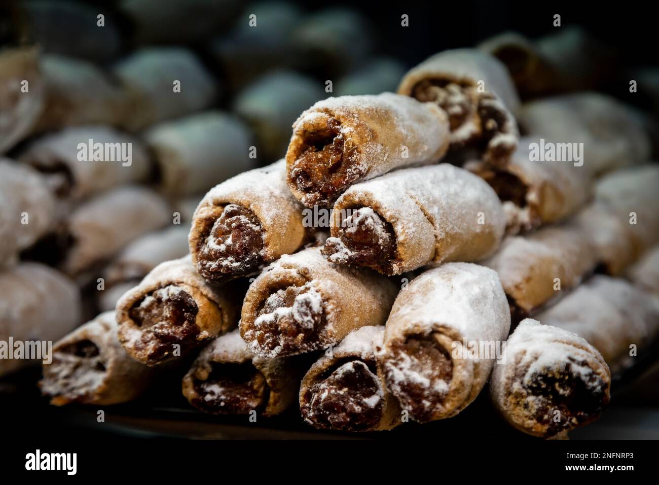 Close Up Still Life of Gourmet Double Scoop Ice Cream Sandwich with Variety  of Flavors Served on Donut with Red Berry Sauce Served on Wooden Paddle  Stock Photo - Alamy