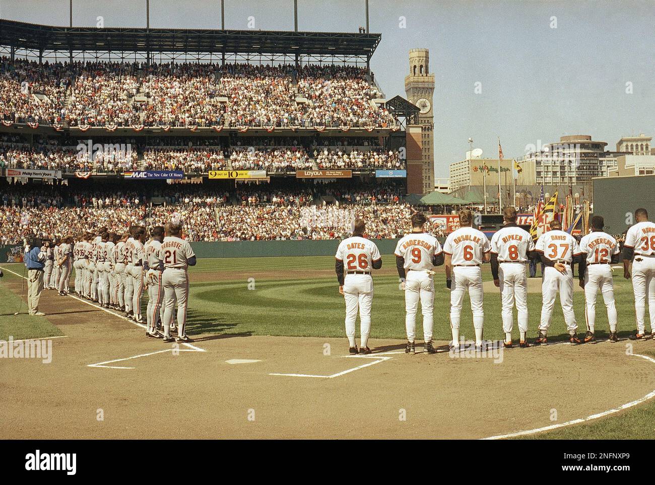 Players stand during opening game at new Camden Yards April 6