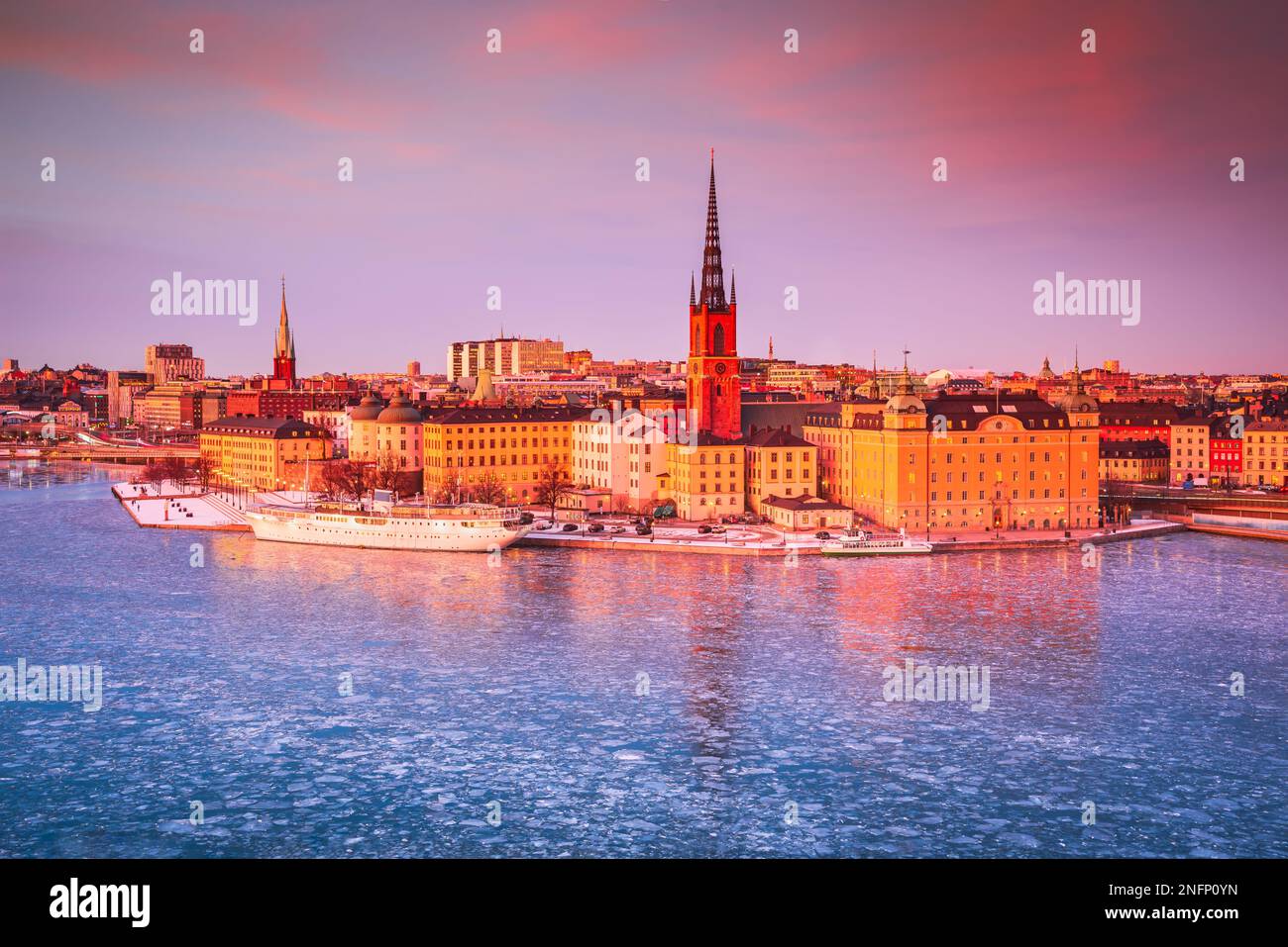 Stockholm, Sweden. Sunset over Gamla Stan, Lake Malaren and Riddarholmen Church, famous Sweden capital downtown. Stock Photo