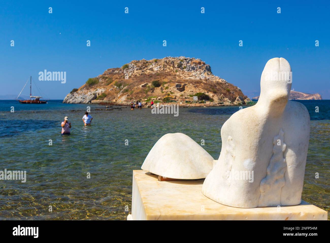sculpture and Tavsan Adasi (Rabbit island), Gumusluk, Turkey Stock