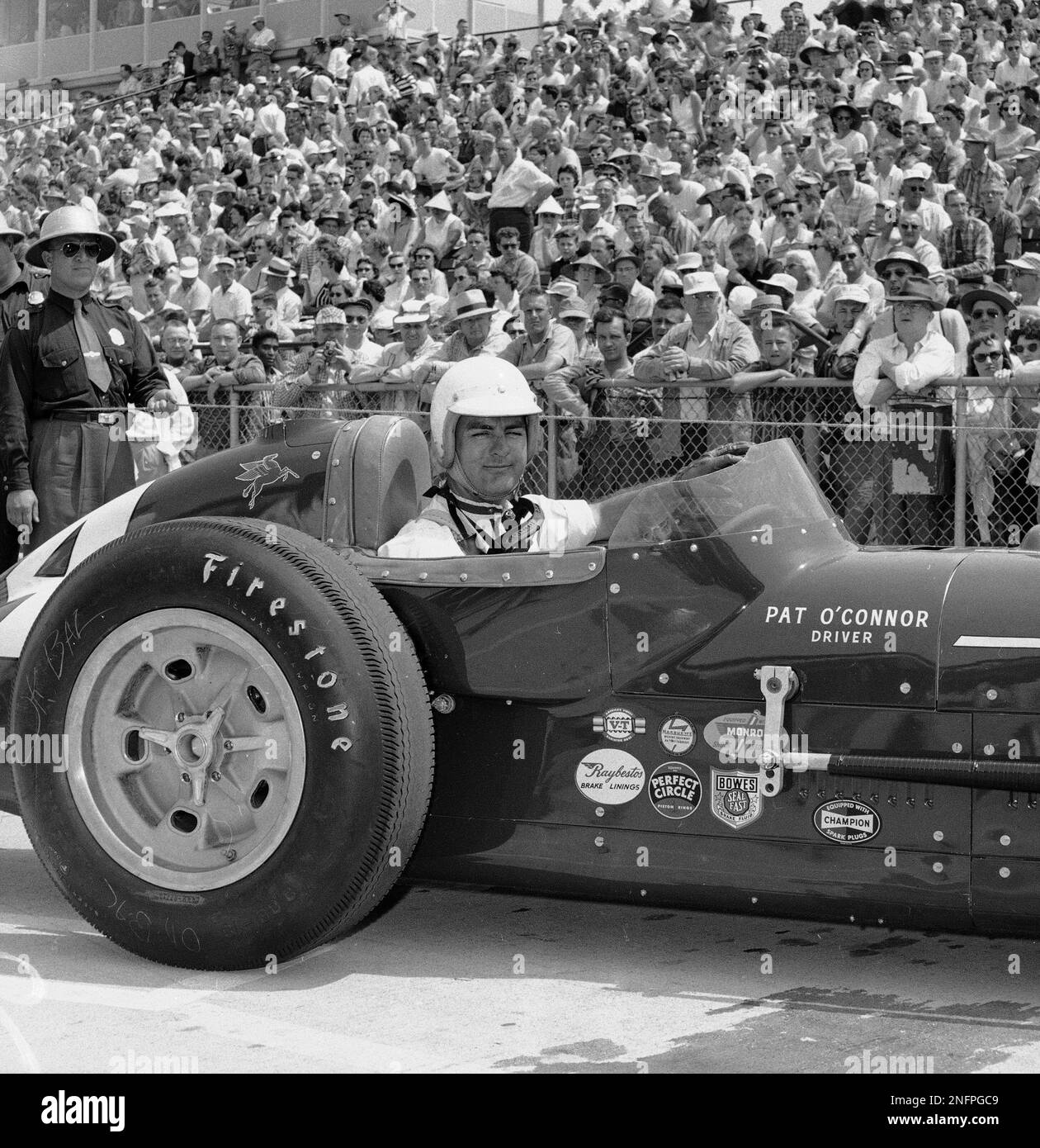 Sumar Racing Patch Pat O'Connor is shown in his Sumar Special, May 17, 1958, after ...