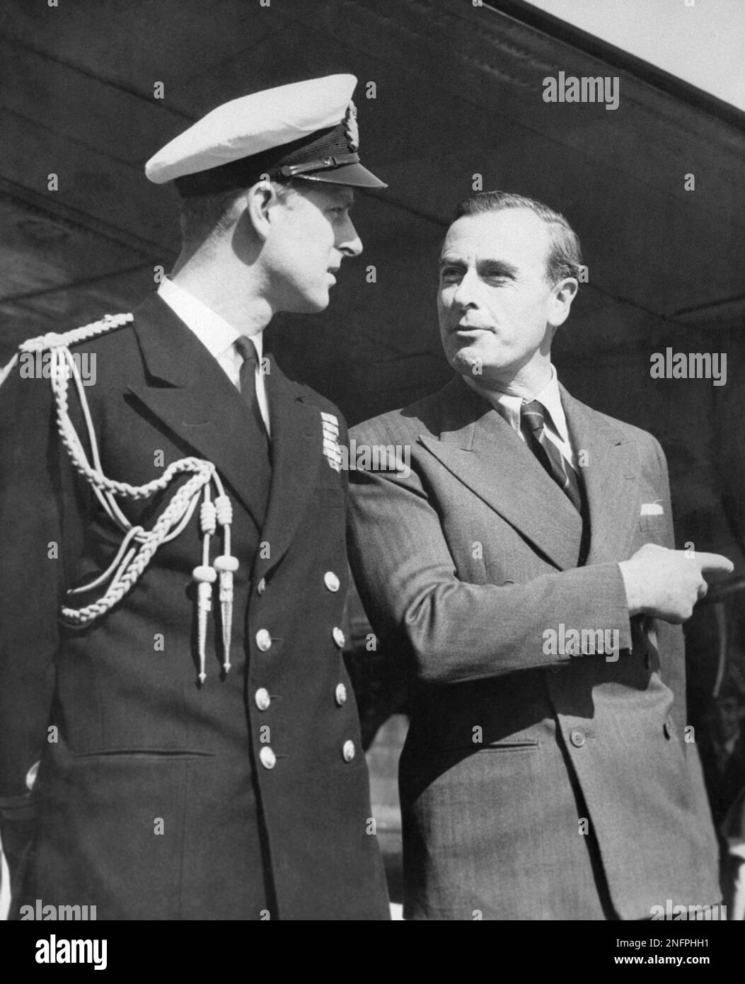 Prince Philip, the Duke of Edinburgh (in uniform), left, chats with his ...