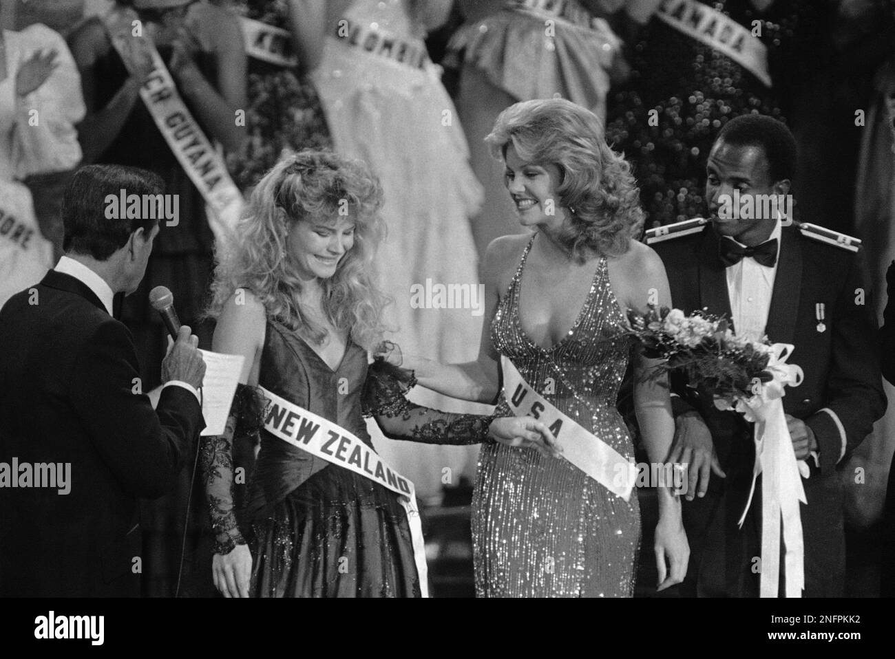 Miss New Zealand, Lorraine Downes, recoils as Miss USA, Julie Hayek was