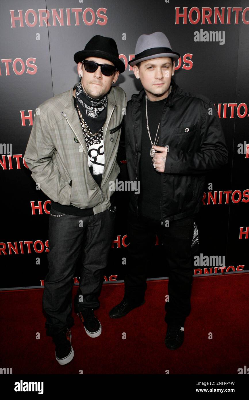 Identical twin brothers Joel Madden, left, and Benji Madden, right, both in the band Good Charlotte, arrive for the Hornitos Tequila Cinco De Mayo party at the Crown Bar on Monday, May 5, 2008 in Los Angeles.. (AP Photo/Danny Moloshok) Stock Photo