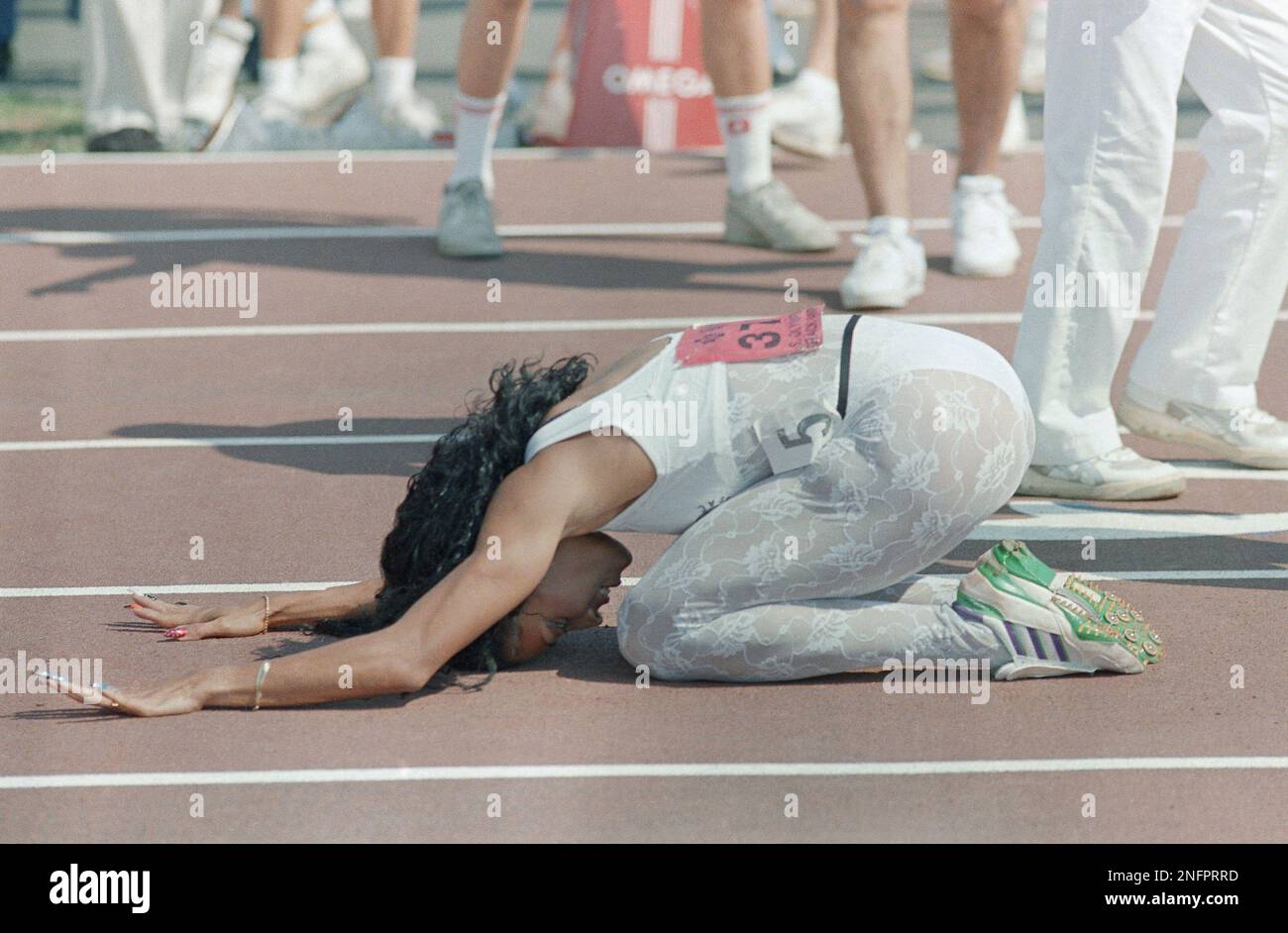 Florence Griffith Joyner reacts after winning the 200 meter dash on at